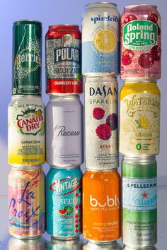 a bunch of different types of sodas on a table