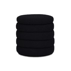 six black round cushions stacked on top of each other