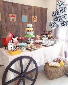 a table topped with lots of cakes and desserts