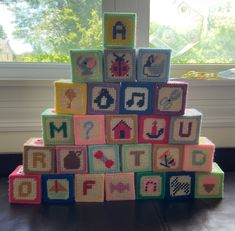 there is a very large number of blocks in the shape of a pyramid with letters and numbers on them