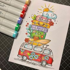 a drawing of a van with surfboards and flowers on the roof is next to markers