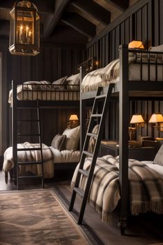 bunk beds are lined up against the wall in this rustic bedroom with wooden flooring