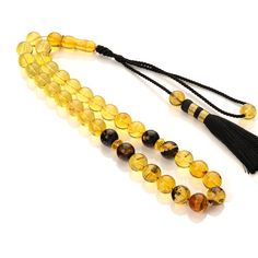 Special Amber rosary. The original collectible rosary is made of natural amber. The imam and beads are carved from genuine amber stones. The amber rosary is assembled on a high-quality thread with a unique handmade tassel. The rosary looks perfect and will be a wonderful accessory that conveys the natural energy and warmth of amber. Tasbih will give you an incredibly pleasant feeling and will be a special gift for you and your loved ones. Weight rosary: 63 g Size Amber Beads: 0,55 in (14 mm)  Imam size: 1,7 in (43 mm) Length rosary with imam: 11 in(28 cm) Looking for a Meaningful Gift - this is an excellent choice! For a gift for the love of a loved one or just for yourself. You buy a high-quality Amber Rosary shown in the photo. ✔ Certificate of Amber Identification - we deliver with each Adjustable Amber Handmade Rosary, Adjustable Amber Spiritual Rosary, Adjustable Amber Rosary As Gift, Spiritual Amber Rosary For Healing, Amber Spiritual Rosary For Healing, Amber Spiritual Healing Rosary, Amber Rosary With 8mm Beads In Spiritual Style, Amber Rosary With 8mm Beads, Spiritual Style, Amber Rosary With 8mm Beads