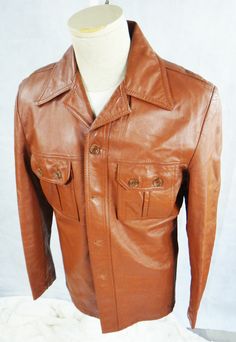 1970s Jacket Size 40 Burnt Orange brown Buffums California (Buffums, originally written as Buffums' with an apostrophe, was a chain of upscale department stores, headquartered in Long Beach, California. The Buffums chain began in 1904,... and it grew slowly over the years to a total of 16 stores in Los Angeles, Orange, and San Diego counties at the time of its closure in 1990.) 21.5"  Armpit to Armpit 27"  Neck to bottom measurements are approximate I only have this ONE, so get it now, or you ma Fitted Retro Vintage Brown Leather Jacket, Fitted Vintage Brown Retro Leather Jacket, Western Brown Fitted Leather Jacket, Retro Brown Leather Outerwear, Retro Brown Leather Jacket, Fitted Retro Leather Jacket, Retro Leather Jacket With Button Closure, 70s Fashion Men, 1970s Jacket