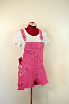 #220821 I have been dying denim regularly - I just started dying other items like these overalls.  They have been a big hit! ABOUT OVERALLS: Overalls are loose fitting. The waist measurement is about 1-2 inches larger than what you would normally wear.  Adult Small 32-34" waist.  Medium  34-36" waist,  large 36-38 waist and  XL are 38-42 waist.  DETAILS: NEW Denim Overalls "No Boundaries" Brand 99% Cotton/1%Spandex Mock Fly -These have a sunflower printed on the denim and it faintly shows throug Orange Overalls, Disneyworld Outfits, Pink Hairband, Womens Overalls, Denim Shortalls, Jeans Rosa, Pink Overalls, White Sleeveless Shirt, Ballet Tights