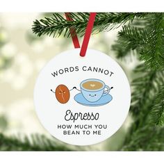 a ceramic ornament hanging on a christmas tree with the words complimentary coffee