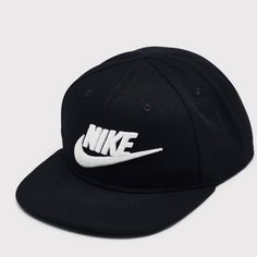 a black hat with white nike logo on it