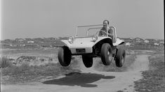 a man riding on the back of an off road vehicle