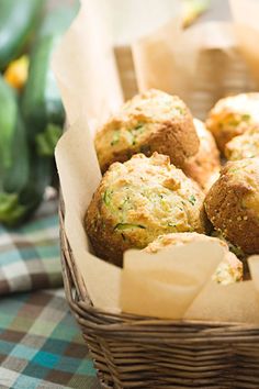 a basket filled with muffins sitting on top of a table