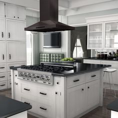 a black and white kitchen with an oven, stove, counter top and cabinets in it