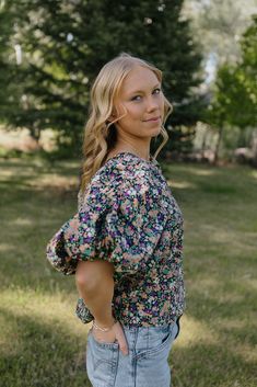 + moody multi-color floral print+ dramatic puffed sleeve+ darling tie detail in the back+ relaxed silhouette+ poplin texture Casual Multicolor Floral Print Puff Sleeve Top, Multicolor Puff Sleeve Top For Fall, Multicolor Puff Sleeve Top With Gathered Sleeves, Puff Sleeve Floral Blouse For Garden Party, Garden Party Puff Sleeve Floral Blouse, Garden Party Floral Print Puff Sleeve Blouse, Multicolor Puff Sleeve Top With Floral Print, Multicolor Floral Print Puff Sleeve Tops, Floral Print Puff Sleeve Top For Day Out