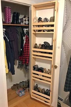 a wooden shoe rack in a closet filled with shoes