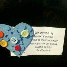 a piece of paper with buttons attached to it and a poem written on the back