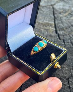 This beautiful antique ring is delicately made with 3 high-quality Persian turquoise and 4 genuine diamonds of old mine cut. The ring itself is crafted in 18k yellow gold. The ring has a pierced gallery to allow light in behind the stones, so stones sparkle even more. It was made around the 1880s in the UK. It is a rare-find antique jewelry because all the turquoise stones and diamonds are still in their original positions and in good condition after 100 years. It also shows how delicate the cra Victorian Turquoise Rings For Gift, Victorian Turquoise Rings As Gifts, Turquoise Victorian Rings For Gift, Vintage Three Stone Emerald Ring Gift, Vintage Three Stone Emerald Ring As Gift, Victorian Emerald Ring With Rose Cut Diamonds For Gift, Persian Turquoise, Antique Ring, Art Nouveau Style