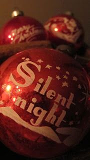 some christmas ornaments with lights on them and the words sleigh night written on one ornament