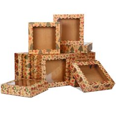 a stack of six boxes with different designs on them