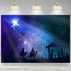 the nativity scene with three wise men and baby jesus in silhouette, surrounded by stars