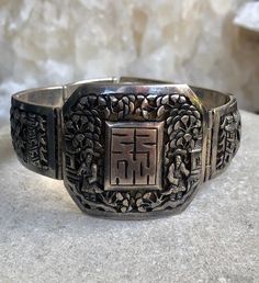 Circa 1920s Beautiful Old Chinese Shou Village Scene Tempel Sterling Silver Vintage Antique Braclet Face measures over 1 1/2 wide by 1 1/2 inches tall Antique Rectangular Ceremonial Jewelry, Antique Rectangular Carved Jewelry, Antique Engraved Wide Band Jewelry, Antique Wide Band Engraved Jewelry, Traditional Stamped Cuff Bracelet For Formal Occasions, Traditional Stamped Cuff Bracelet For Formal Wear, Vintage Engraved Cuff Bracelet For Ceremonial Occasions, Vintage Rectangular Bracelet Strap Jewelry, Vintage Wide Band Bracelet For Formal Occasions