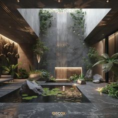 the interior of a modern house with water features and greenery on the outside wall