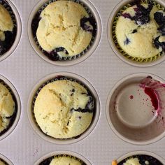 twelve blueberry muffins are in the cupcake tin