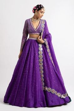 Purple lehenga in silk organza base with sequins spread. Paired with intricately hand embroidered V-neck blouse clubbed with hand cut mirror border dupatta. Component: 3 Pattern: Embroidered Type Of Work: Sequins, Mirror Neckline: Plunge V-neck Sleeve Type: Straight Full Fabric: Lehenga and Dupatta: Organza; Blouse: Georgette; Lining: Silk Blend Color: Purple Other Details:  High waisted lehenga Mirror, cutwork dupatta Back cut-out blouse Note: The lehenga sets worn by the model on the right and Vani Vats, Mirror Border, Organza Lehenga, Lehenga Designs Simple, Organza Blouse, Engagement Outfit, Embroidered Wedding, Silk Lehenga