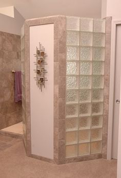 a walk in shower sitting inside of a bathroom