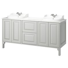 two white sinks sitting next to each other