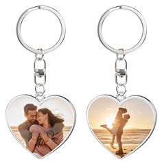 two heart shaped key chains with an image of a man and woman holding each other