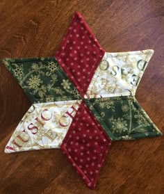 a quilted star on top of a wooden table