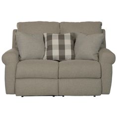 the reclining loveseat has two pillows on it and is in front of a white background