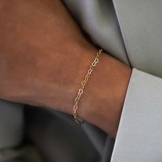 Dainty Heart-shaped links connect together to make a beautiful everyday bracelet. 14K Solid Gold Hypoallergenic, lead and nickel free Length: 6-7in (15-18cm) Heart Link width 0.12in(3mm) Spring clasp closure #BS024 Elegant Hypoallergenic Heart Bracelet For Everyday, Elegant Everyday Hypoallergenic Heart Bracelet, Elegant Heart Bracelet With Delicate Chain For Everyday, Gold Classic Heart Bracelet For Everyday Wear, Classic Gold Heart Bracelet For Everyday, Elegant Everyday Heart Bracelet With Delicate Chain, Dainty 14k Gold Chain Bracelet, Hypoallergenic Gold Link Bracelet, 14k Gold Heart Bracelet For Everyday