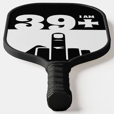 a close up of a black and white paddle with the number 899 on it