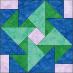 a blue and green quilt with an abstract design in the center, on a white background