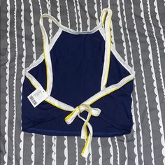 Urban Outfitters Large Tied Tank, Navy With White And Yellow Piping Casual Vacation Tops With Tied Detail, Casual Tied Tops For Vacation, Casual Beach Tops With Tied Details, Casual Tied Tops For Beach, Summer Vacation Tops With Tied Details, Blue Vacation Top With Drawstring, Blue Drawstring Top For Vacation, Casual Beach Tops With Drawstring Tie, Casual Beach Top With Tie Waist