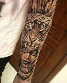 a man's arm with a tiger and woman tattoo on the left side of his arm