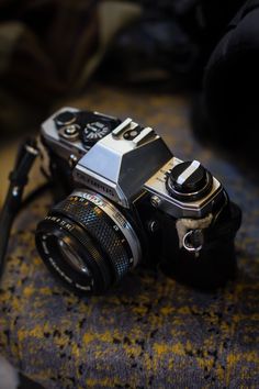 a camera sitting on top of a chair