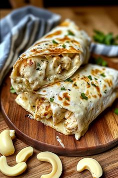 two quesadillas stacked on top of each other on a wooden platter