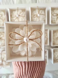 a white box with a flower in it