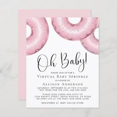 a baby shower with pink donuts and sprinkles