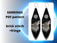 the earrings are made out of black and white beaded fabric with an image of a wolf on it