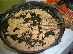 a pan filled with oatmeal sitting on top of a stove