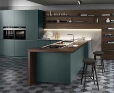 a modern kitchen with an island in the middle and two stools at the counter