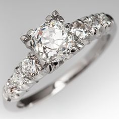 a diamond ring with five stones on it