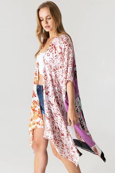 Boho print kimono with contrasting prints. Ultra light, draping open-front. Light and billowy silhouette, perfect for effortless layering. CARE | Hand Wash Cold or Dry Clean CONTENTS | 100% Viscose MEASUREMENTS | 36"/91 cm Top to Bottom (Size O/S) MODEL | 5'8 - wearing O/S IMPORTED Multicolor Printed Wrap Cover-up, White V-neck Kimono For Day Out, Multicolor Print Kimono For Spring Beach Cover-up, Casual White Printed Kimono, Casual Printed White Kimono, Flowy Open Front Printed Cover-up, Open Front Layering Cover-up, White Floral Print Wrap Kimono, White Flowy Kimono With Kimono Sleeves