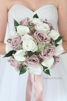 a bridal holding a bouquet of white and pink flowers