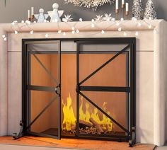 a fireplace with a fire in it and christmas decorations