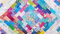 a multicolored patchwork quilt is displayed