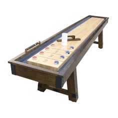 a shuffle board table with several pieces of wood and tape around it, on an isolated white background