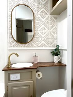 a bathroom with a sink and mirror on the wall