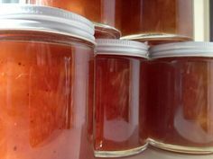 several jars filled with different kinds of food